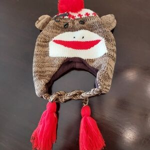 Sock Monkey Earflap Hat with Red Tassels. NWOT.